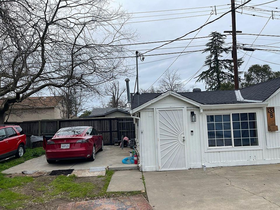 Front of home and parking/yard area