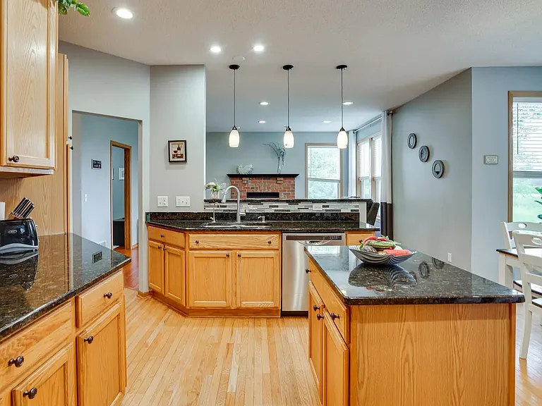 kitchen overlook breakfast bar and main floor family room