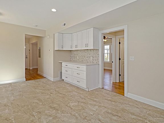 This kitchen offers tremendous counter space and cabinets.