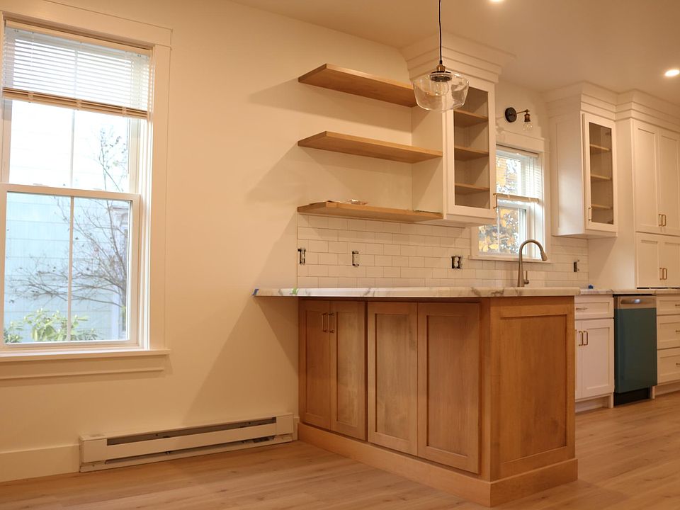 Bar with floating shelves. Room for dining table.