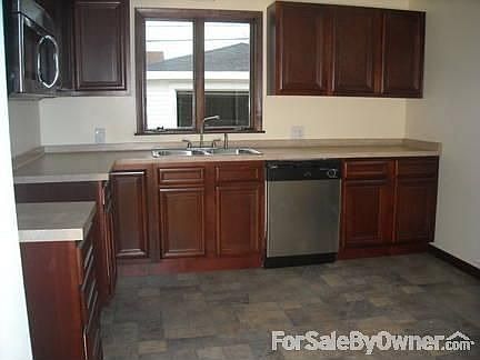 Kitchen
						:
						Outside Wall with New Stainless Steel Dishwasher