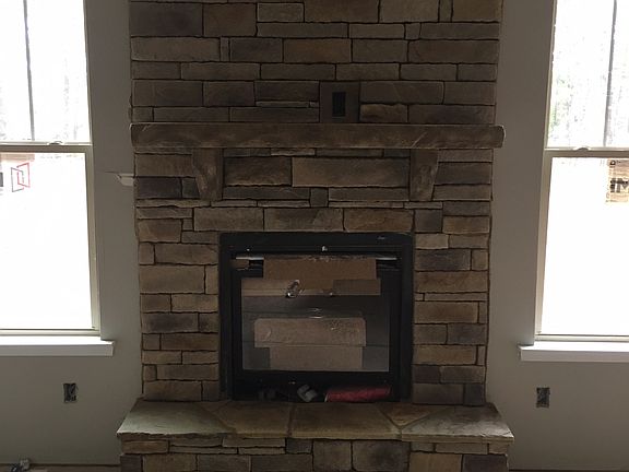 Stone wrapped fireplace 