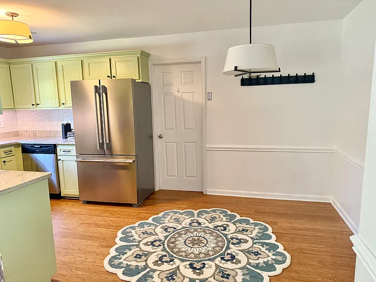 Washer dryer located off kitchen