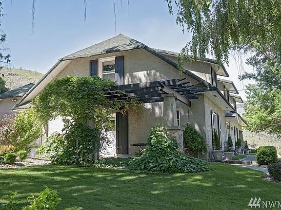 The Wisteria blooms twice a year, in the Spring and again in late Summer.  The lush greens climbing the pergola adds character during the Spring, Summer into the Fall.