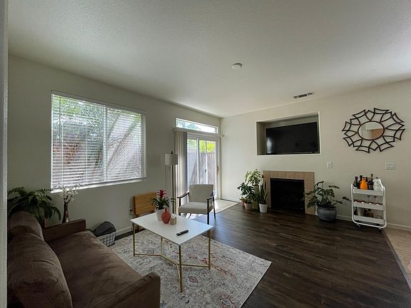Family room with gas fireplace opening up to the patio