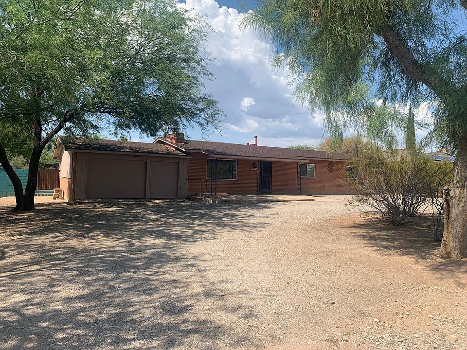 Front of home; garage, round drive way.