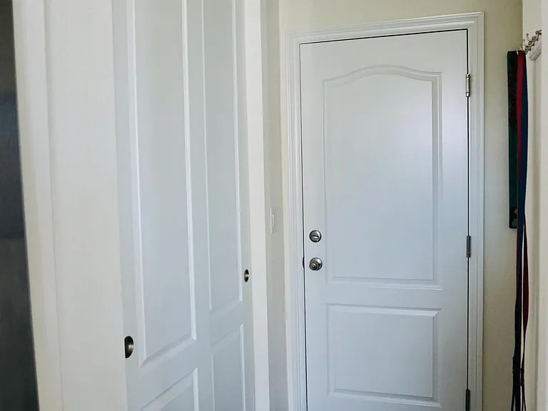Hallway to garage and basement (with a closet)