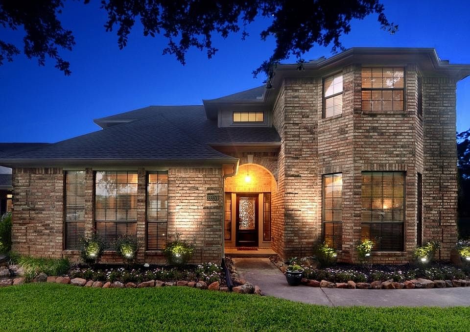 Inside the Gated Community of Weston Lakes, tucked away on a tree lined cul de sac, you'll find this