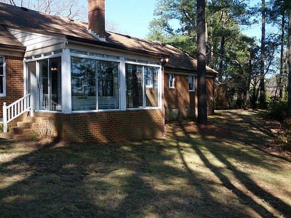 Glassed-in back porch.