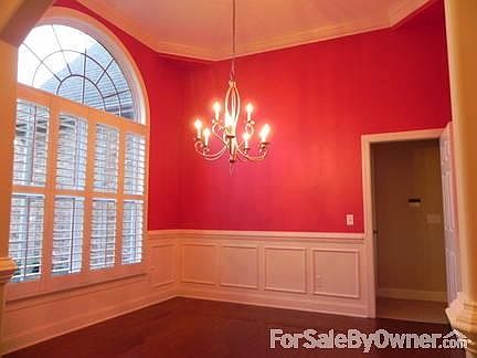 Formal dining room : Formal dining room with plantation shutters and shadow boxing on the walls.