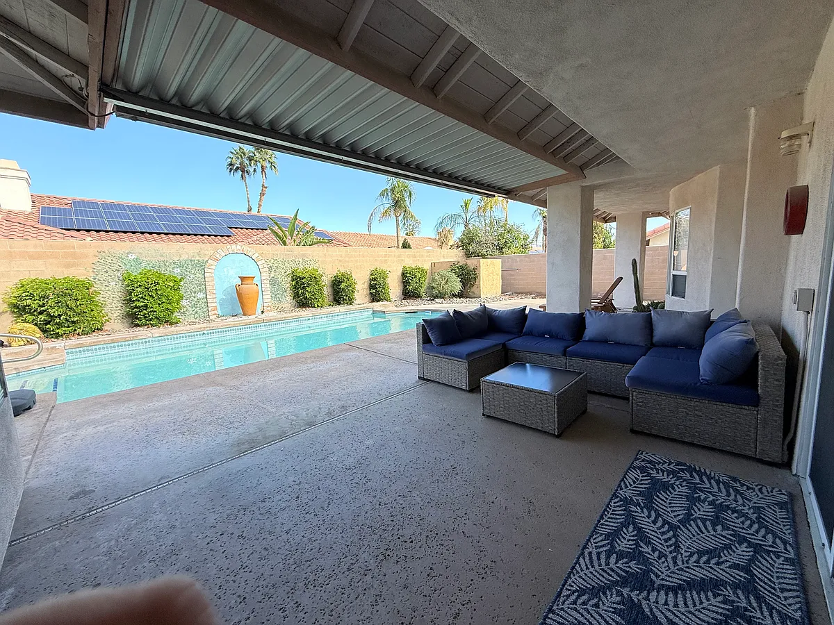 Backyard seating area, lap-pool and lounge space - 77530 Carinda Ct