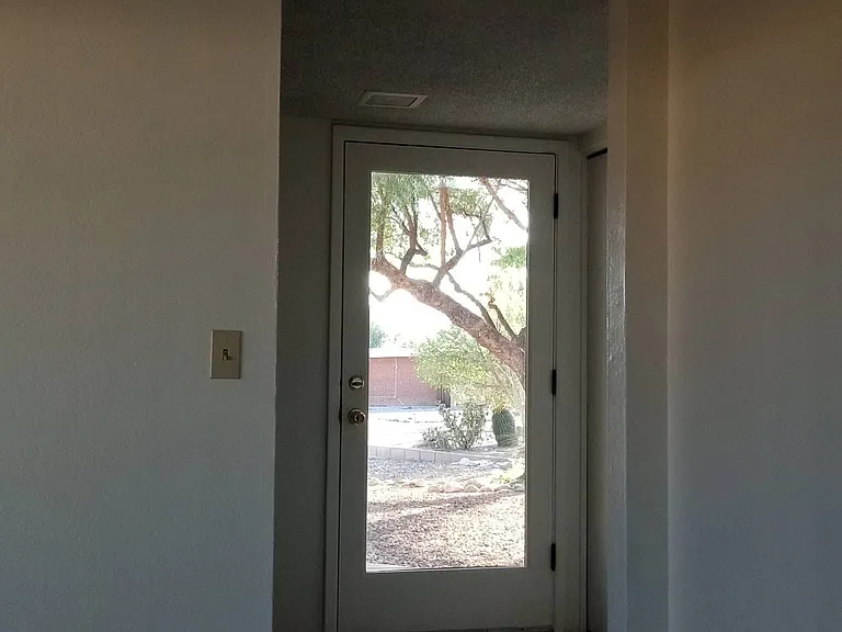 Front door view from kitchen/entry