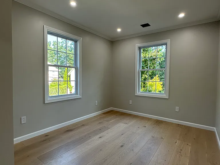 Bedroom with ample natural light and nature views