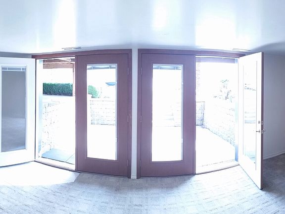 Living room french doors to waterfront Patio