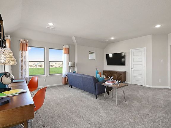 Game room in the Masters home plan by Trophy Signature Homes - REPRESENTATIVE PHOTO