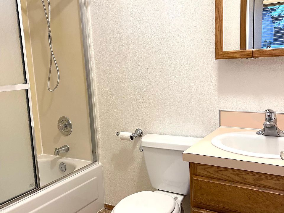 This is the original bathroom. It now has a tile tub surround, new cabinet, new floors and new mirror.