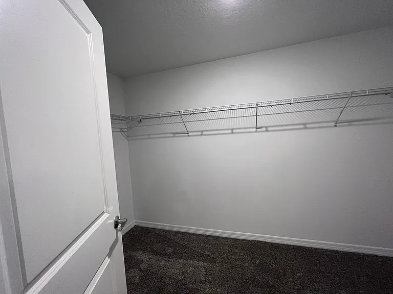 Huge walk-in closet for primary bedroom