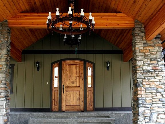 Exposed aggregate stairway leads you from the Grand Portico to the front entry which boasts a solid 