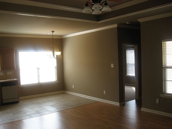 Living room with tray ceiling/eat in kitchen