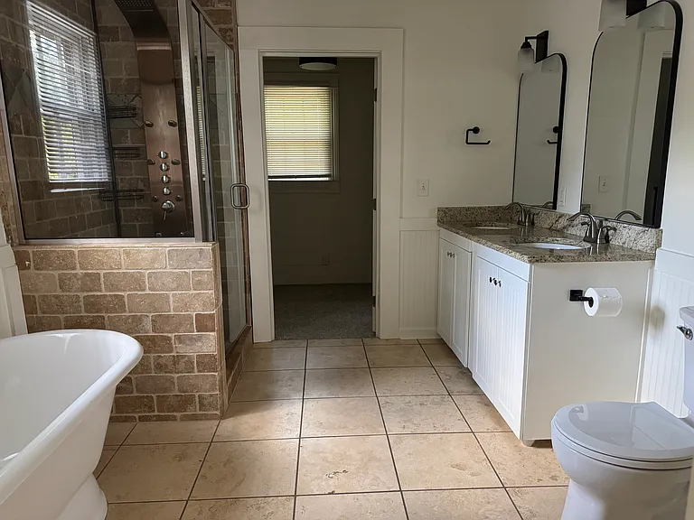 Upstairs bathroom w/ shower + bath tub.