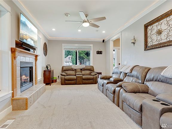 Living Room with Gas Fireplace, Back Lit Crown Molding.  