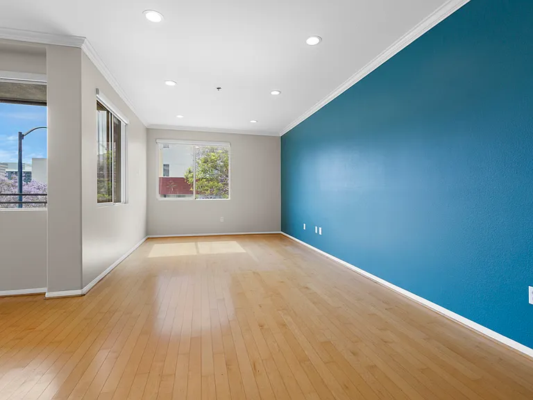 Living Room w/City Views and Remote Operated Roller Shades