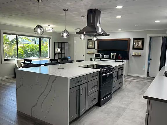 A kitchen to cook in as a family or hire a chef to cook while he entertains you