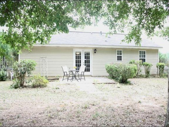 Large fenced in backyard with lots of treeds for shade