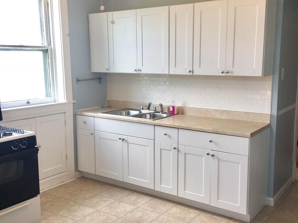 Updated kitchen cabinets with stainless double sink. Extra s