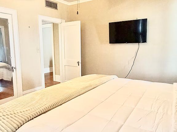 Big bedroom with smart TV and plenty of storage. Insulated blackout curtains.