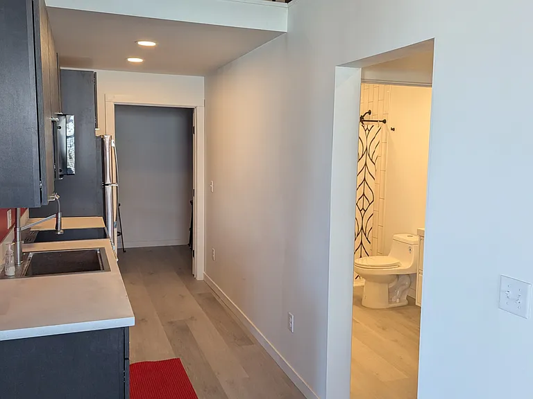 View facing kitchen with storage loft above
