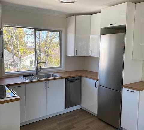 kitchen with new refrigerator