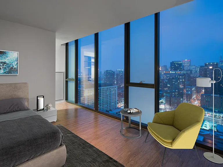 Floor-to-ceiling views from your penthouse bedroom