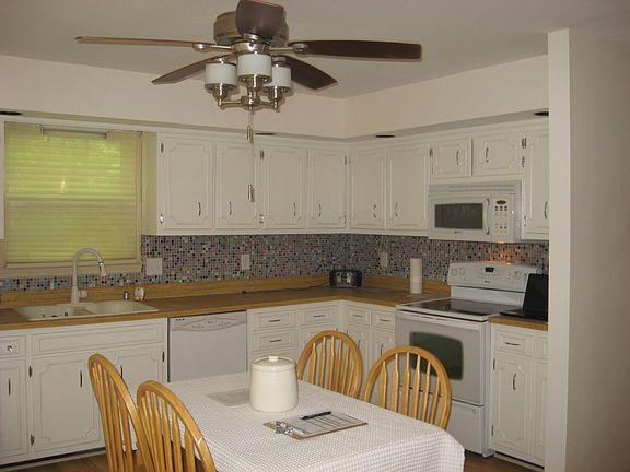 Another view of kitchen. Freshly painted walls and cabinets.