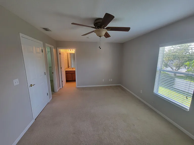 Master bedroom with walk-in closet and en-suite bathroom.