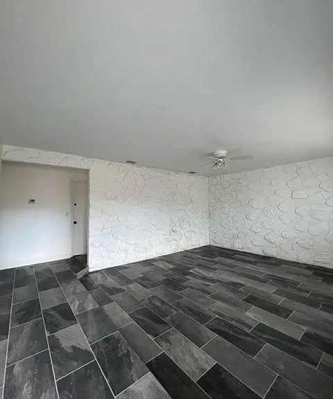 View of the living room while entering the main door.