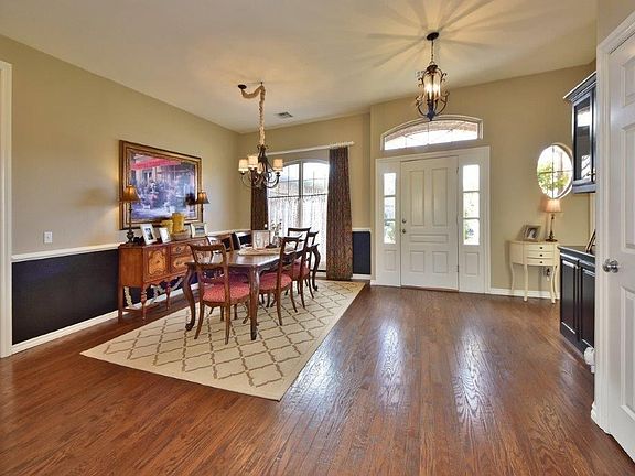 Formal dining with hand scraped wood floors