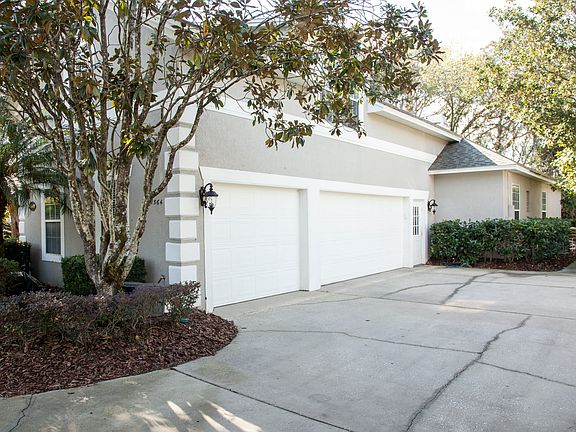 3 Car Garage with wood panel