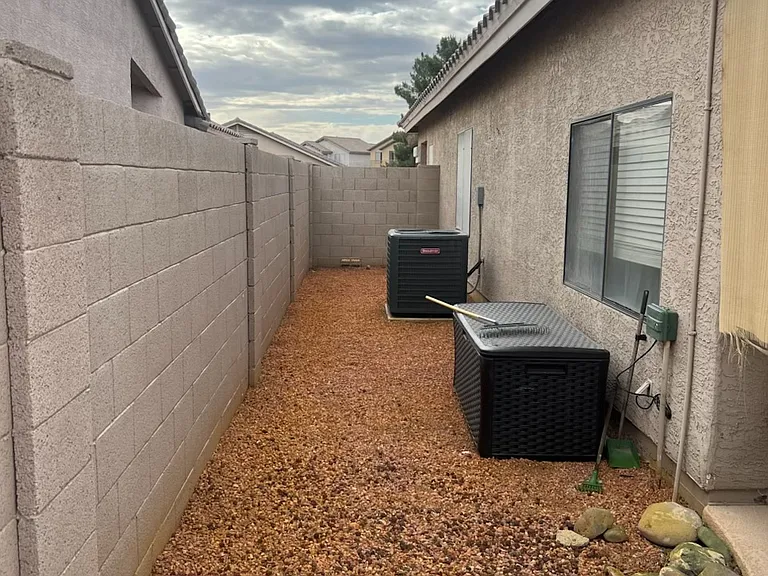 New A/C Exterior was painted after these photos taken. Rocks were sprayed for weeds- Rocks were wet in this photo