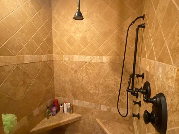 Walk in shower with jets and hand held sprayer