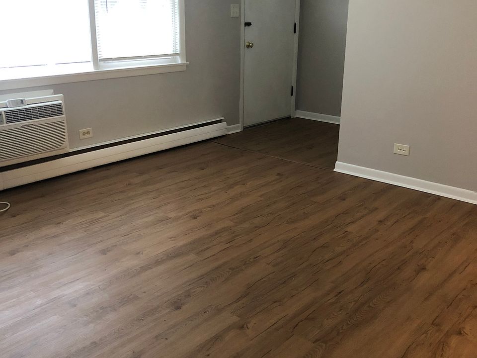 large bright windows, hardwood floors, private front and back door entrance