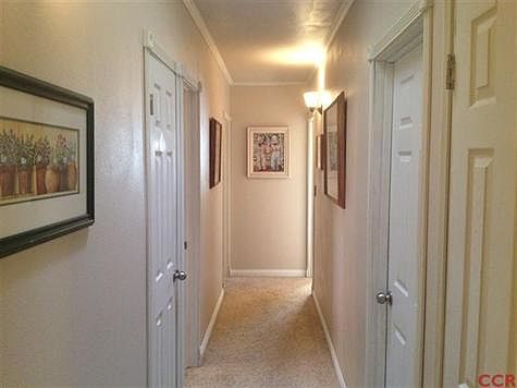 View of hallway leading to bedrooms. Well maintained home throughout