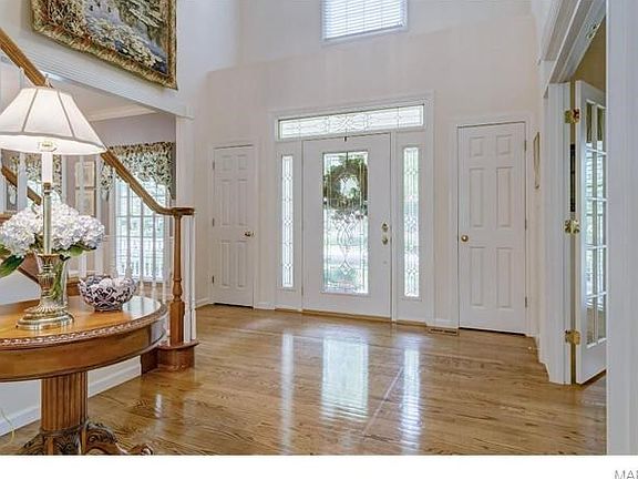 2-Story entry Foyer complimented by wood flooring