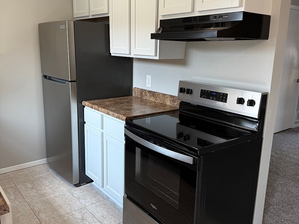 New stainless steel stove and refrigerator. New kitchen cabinets