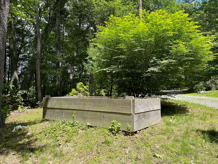 Large planter box available for gardening as well as other spaces around the yard.