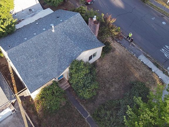 My brother-in-law (in the yellow vest) brought his drone to survey my property. I want one of those!