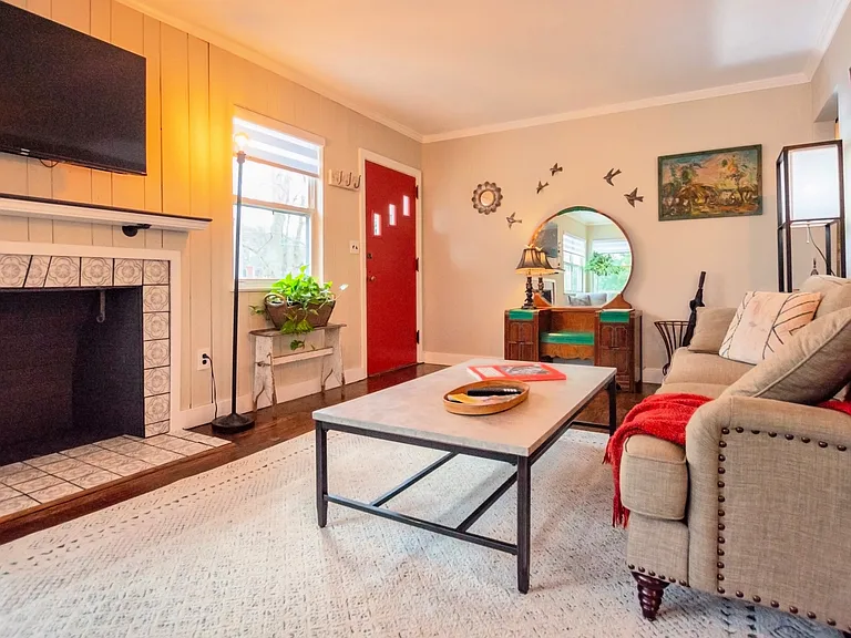 Living room view of the front entry door