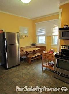 Eat-in Kitchen : This corner table is a perfect fit. Includes storage in bench seating.