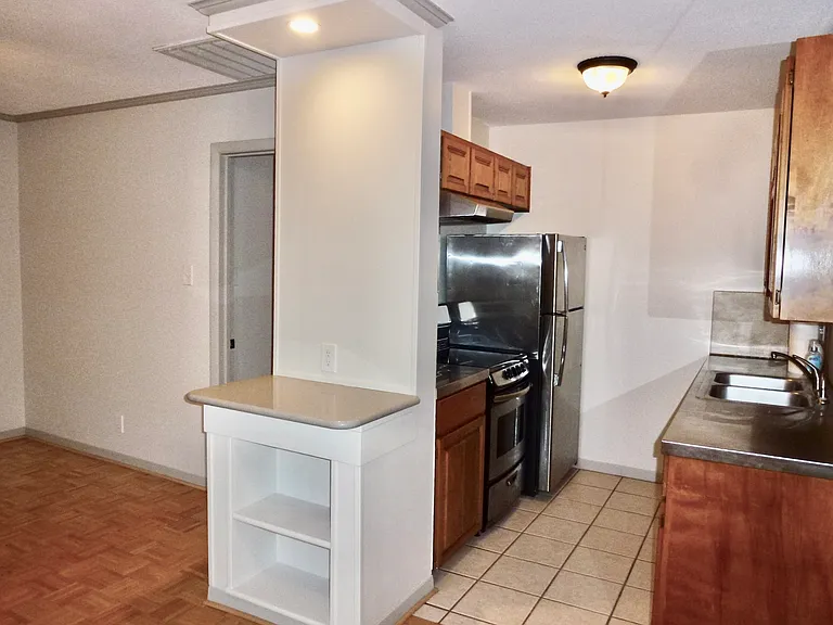 Full size stainless refrigerator.