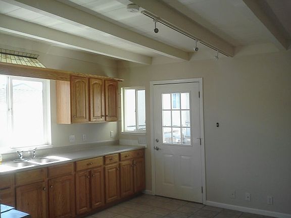 kitchen w/ built in refridg & stove